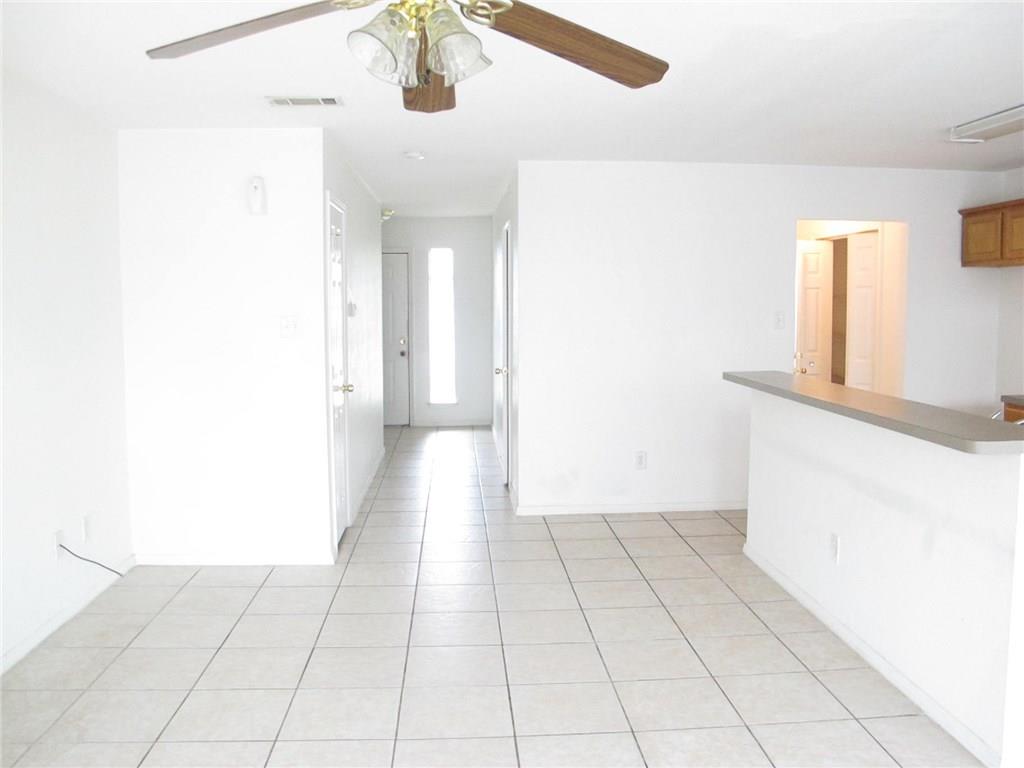 4503 Fortuna Street Fort Worth, TX 76119 - Photo 11 of 26 a view of a livingroom with an empty space and a window