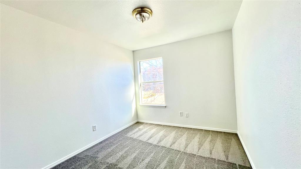 4503 Fortuna Street Fort Worth, TX 76119 - Photo 18 of 26 a view of an empty room with a window