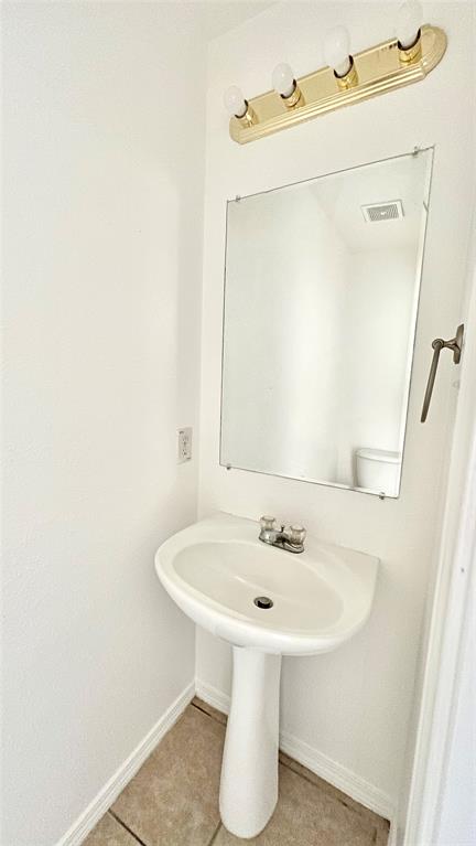 4503 Fortuna Street Fort Worth, TX 76119 - Photo 22 of 26 a bathroom with a sink and a mirror