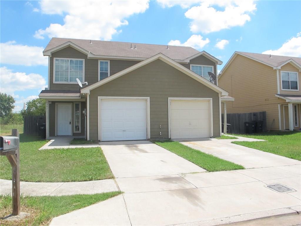 4503 Fortuna Street Fort Worth, TX 76119 - Photo 26 of 26 a front view of a house with a yard and garage