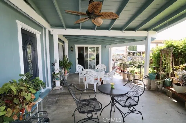 a dining room with furniture water view and a potted plant