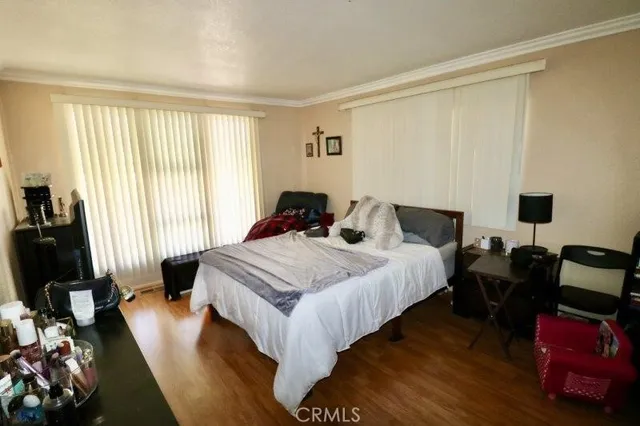 a bedroom with bed and a window