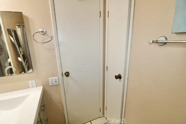a bathroom with a tub a sink and vanity