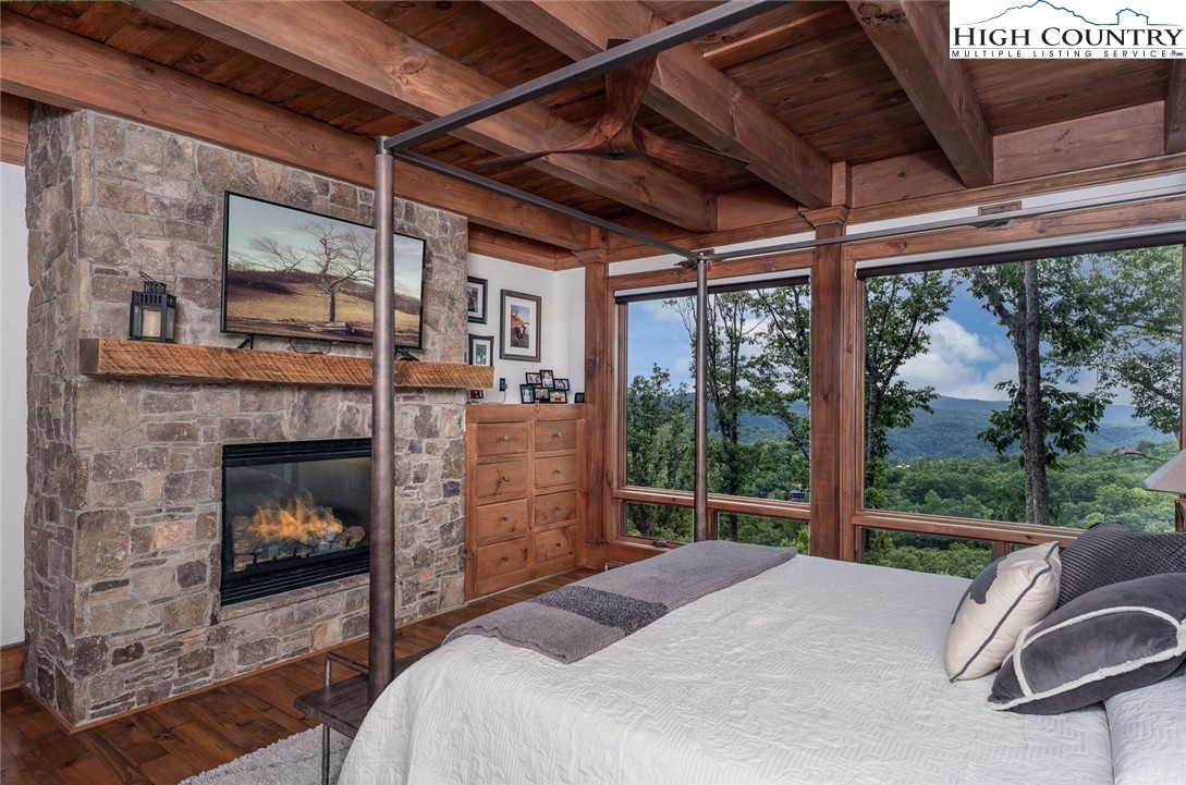 550 Pepperroot Road Boone, NC 28607 - Photo 24 of 50 a bed sitting in a bedroom next to a window