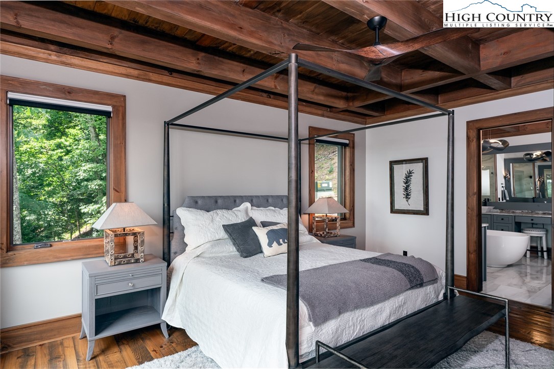 550 Pepperroot Road Boone, NC 28607 - Photo 25 of 50 a bedroom with a bed and wooden floor