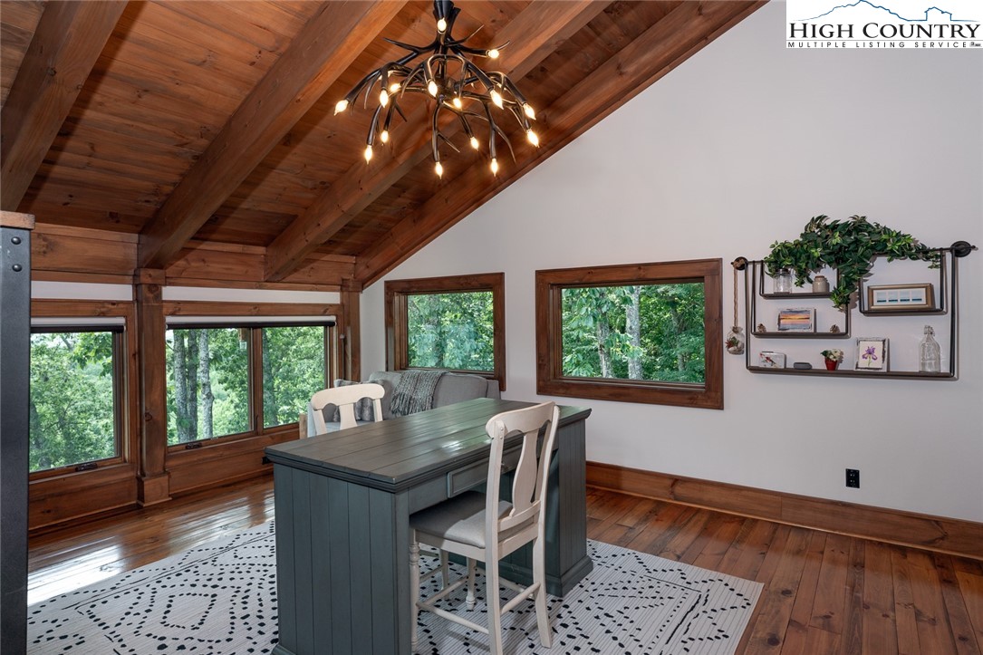 550 Pepperroot Road Boone, NC 28607 - Photo 30 of 50 a dining room with furniture a rug and wooden floor