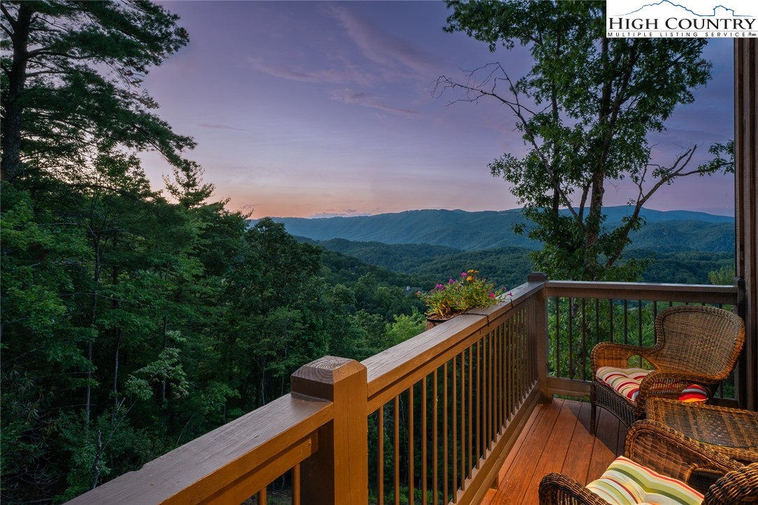 550 Pepperroot Road Boone, NC 28607 - Photo 3 of 50 a balcony with wooden floor and yard in the back