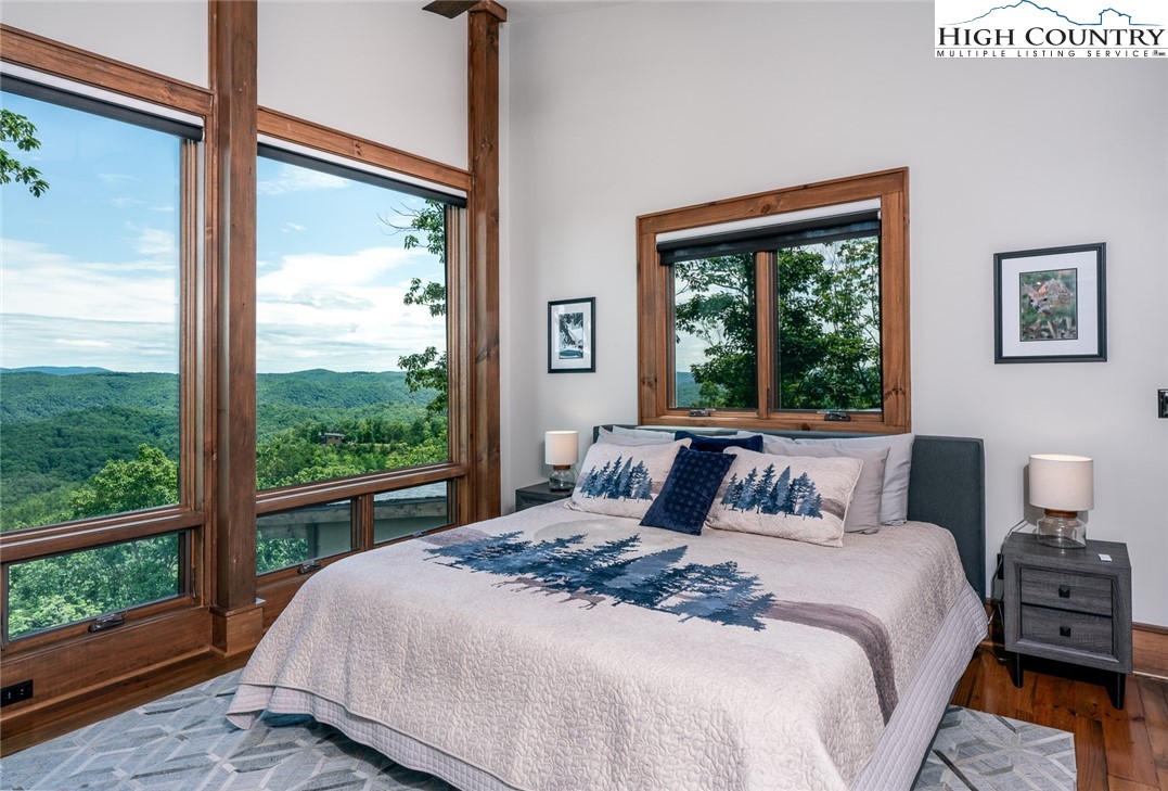 550 Pepperroot Road Boone, NC 28607 - Photo 38 of 50 a bedroom with a large bed and a large window