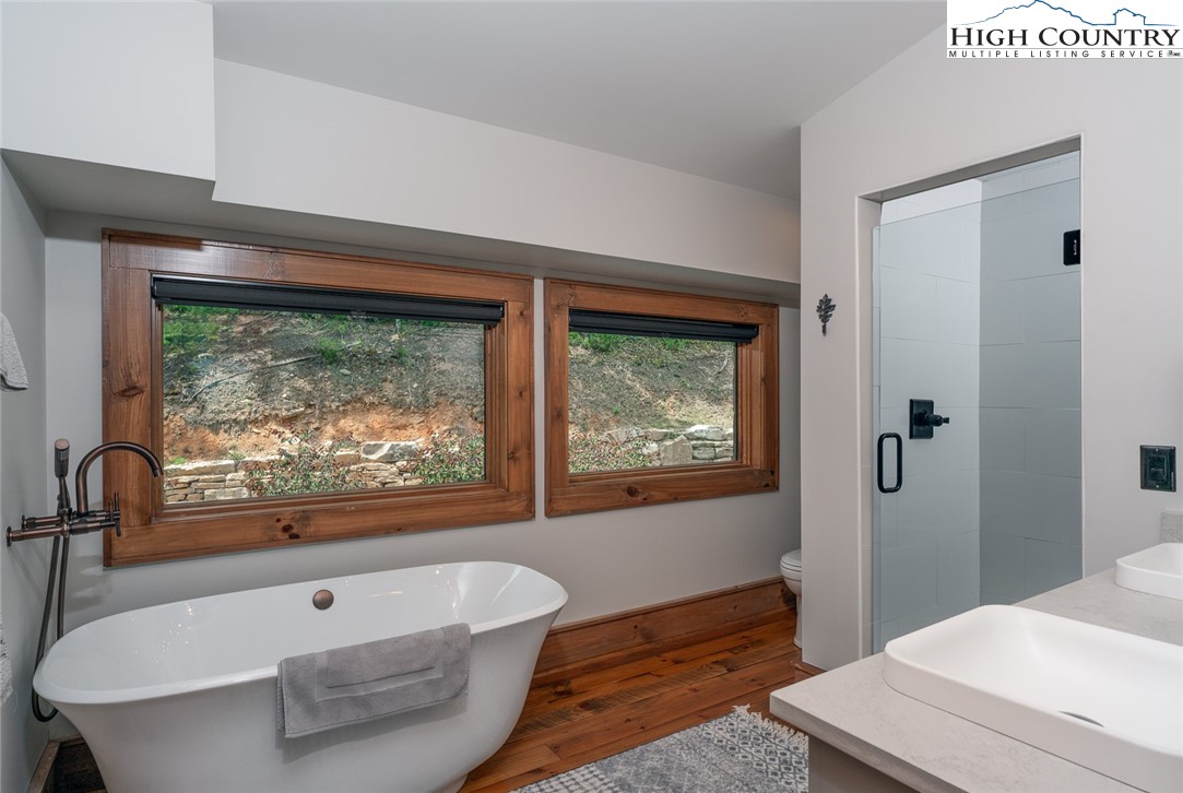 550 Pepperroot Road Boone, NC 28607 - Photo 41 of 50 a bathroom with a bathtub and a window