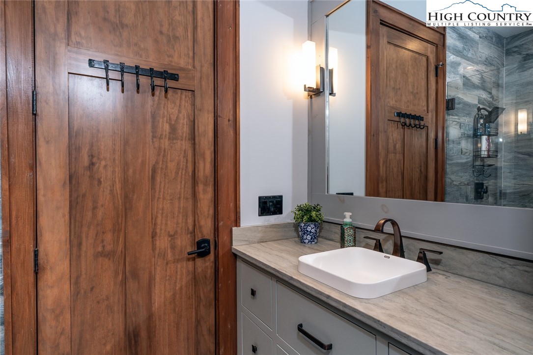 550 Pepperroot Road Boone, NC 28607 - Photo 47 of 50 a bathroom with a double vanity sink and mirror