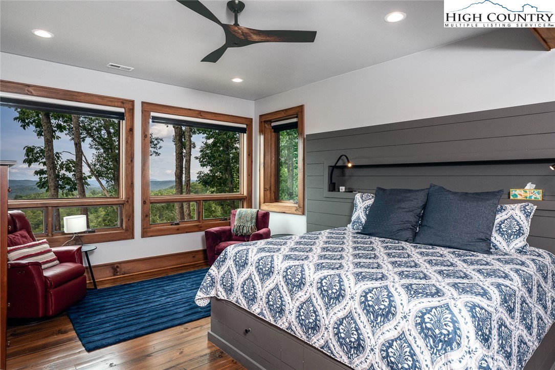 550 Pepperroot Road Boone, NC 28607 - Photo 48 of 50 a bedroom with a large bed and a large window