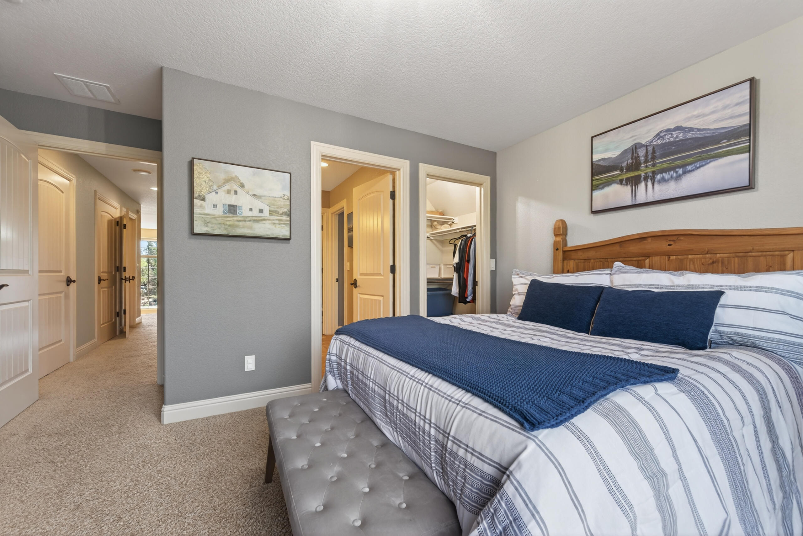 9009 Merlin Drive Redmond, OR 97756 - Photo 50 of 98 a bedroom with a bed and a painting on the wall