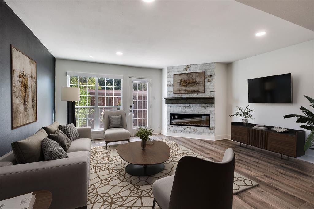 1257 Roaring Springs Road Fort Worth, TX 76114 - Photo 2 of 11 a living room with furniture flat screen tv and a fireplace
