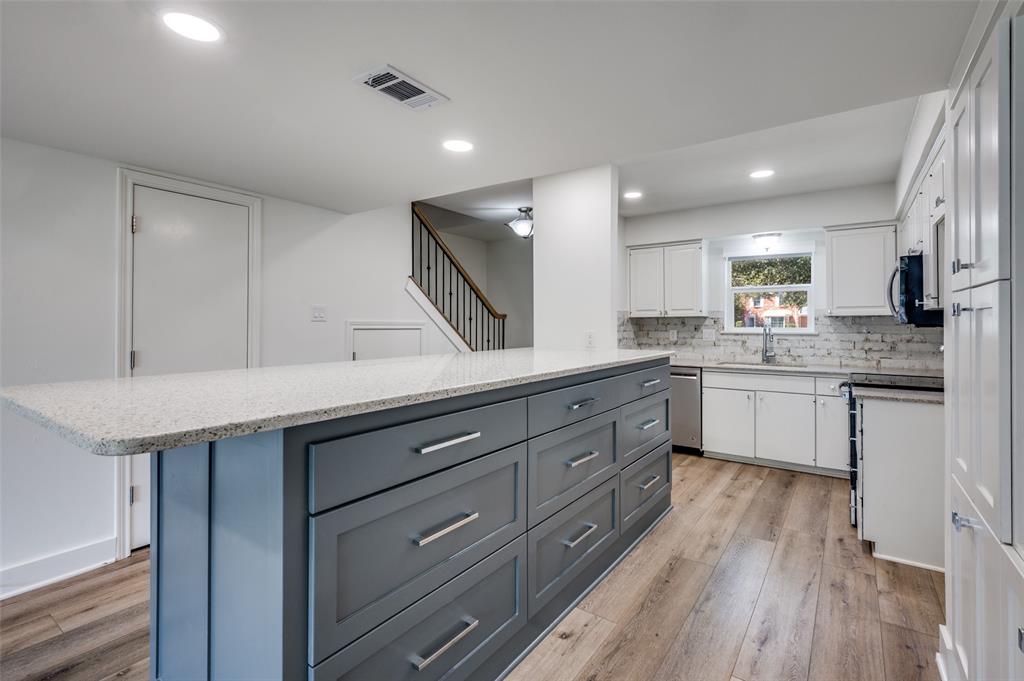 1257 Roaring Springs Road Fort Worth, TX 76114 - Photo 6 of 11 a kitchen with a sink stainless steel appliances and cabinets