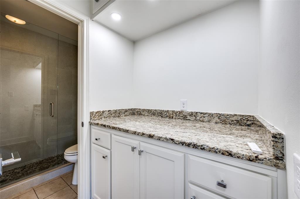 1257 Roaring Springs Road Fort Worth, TX 76114 - Photo 9 of 11 a bathroom with a granite countertop sink and a mirror