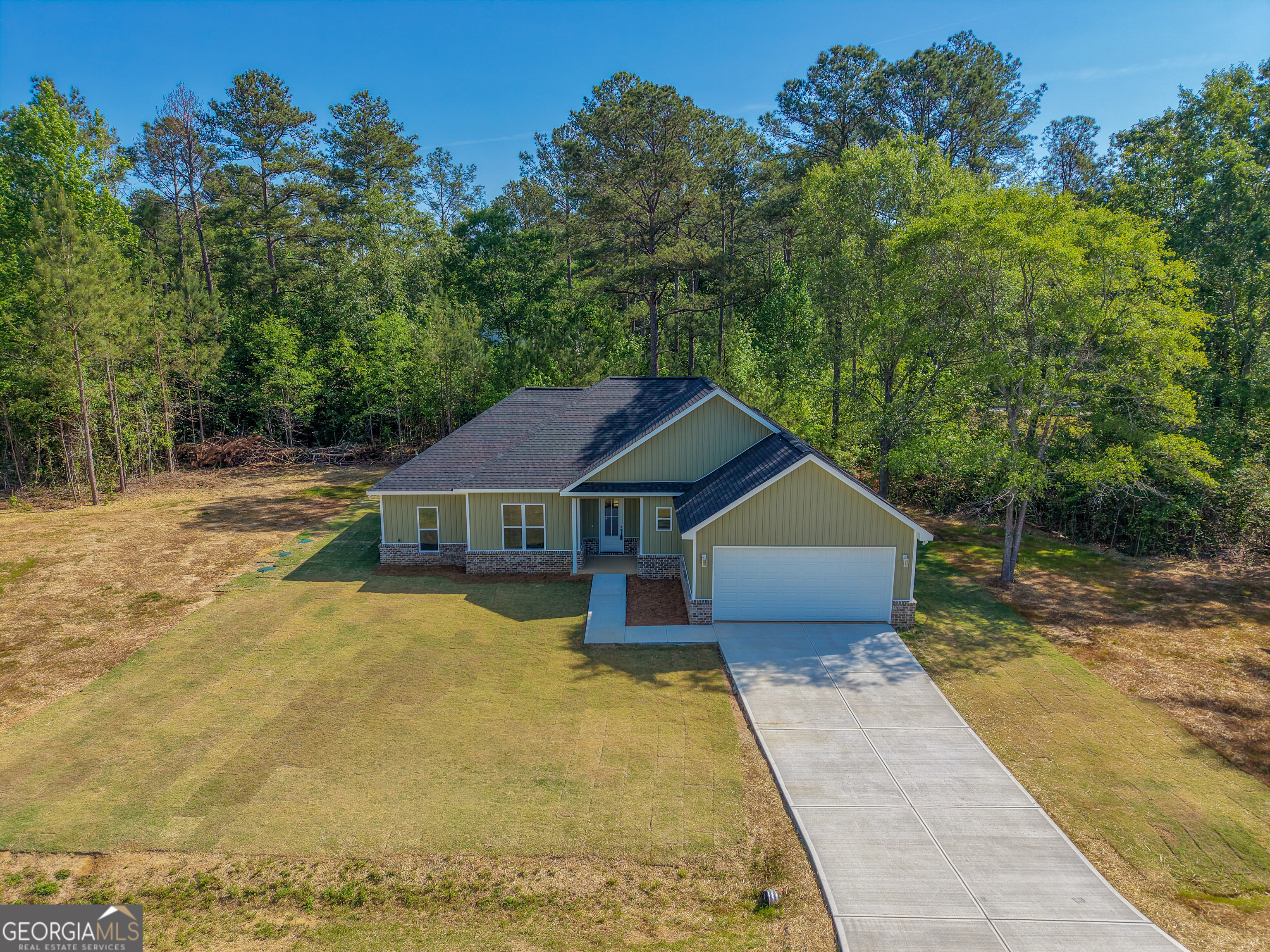 711 Flanders Lane Dublin, GA 31021 - Photo 43 of 49 a front view of a house with a yard and trees