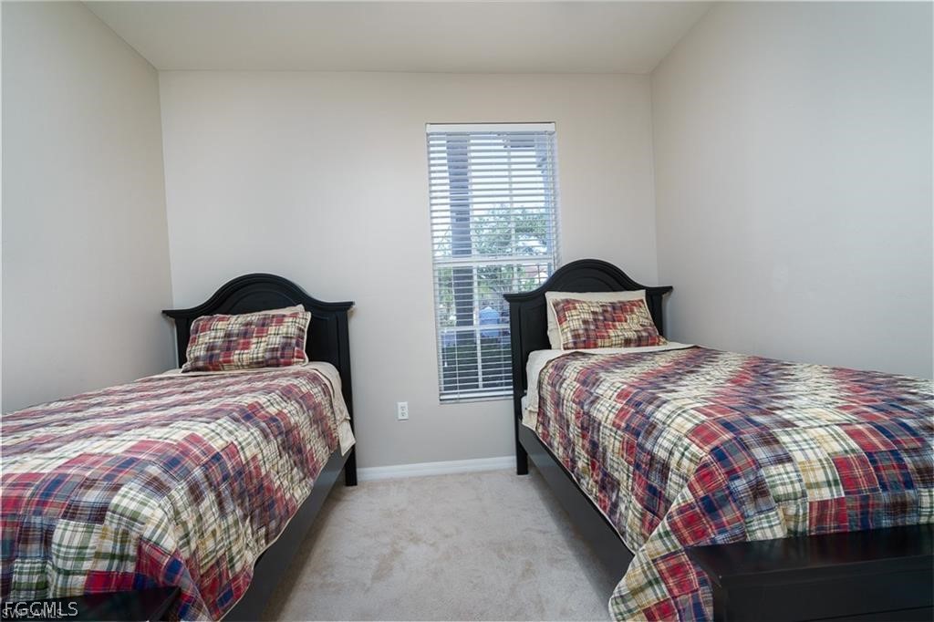 9667 Hemingway Lane, Unit 3107 Fort Myers, FL 33913 - Photo 11 of 23 a bedroom with a bed and window