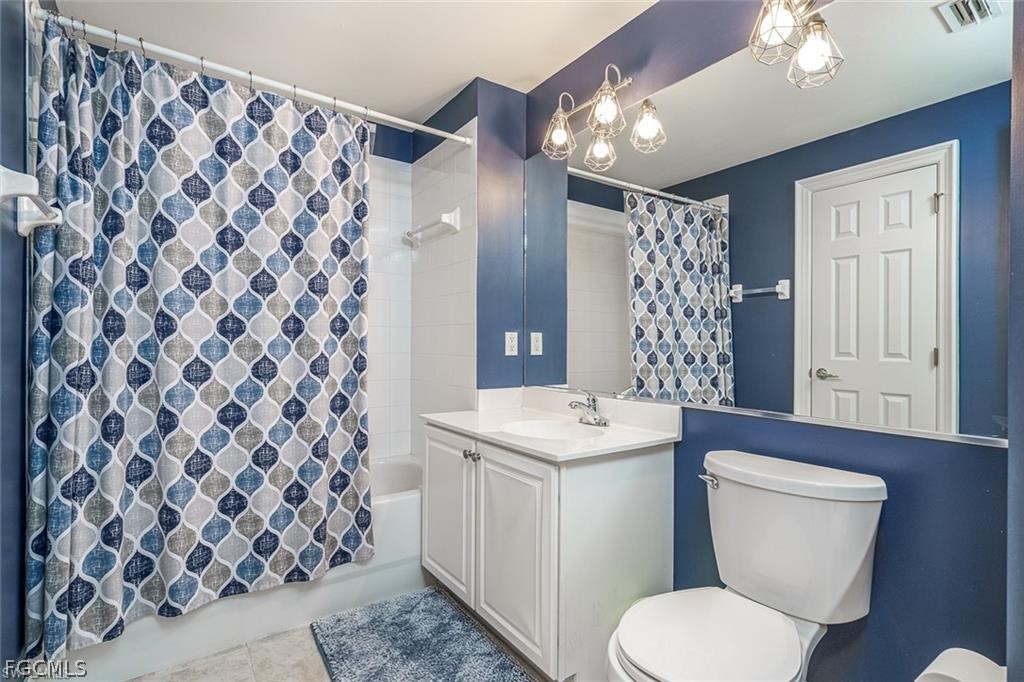 9667 Hemingway Lane, Unit 3107 Fort Myers, FL 33913 - Photo 12 of 23 a bathroom with a sink toilet and shower