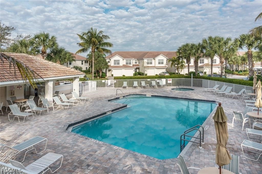 9667 Hemingway Lane, Unit 3107 Fort Myers, FL 33913 - Photo 15 of 23 a view of a house with backyard porch and sitting area