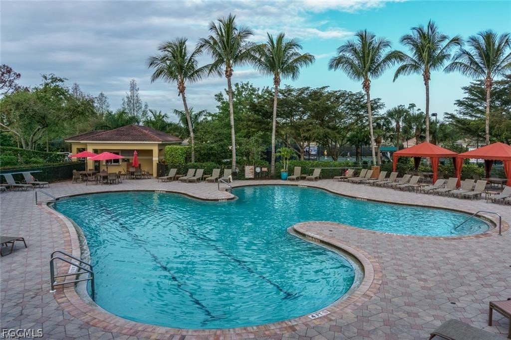 9667 Hemingway Lane, Unit 3107 Fort Myers, FL 33913 - Photo 16 of 23 a view of a swimming pool with sitting area