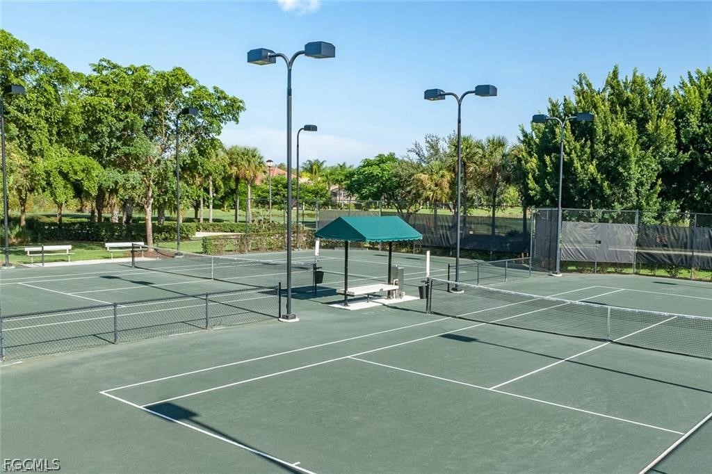9667 Hemingway Lane, Unit 3107 Fort Myers, FL 33913 - Photo 22 of 23 a view of a tennis court