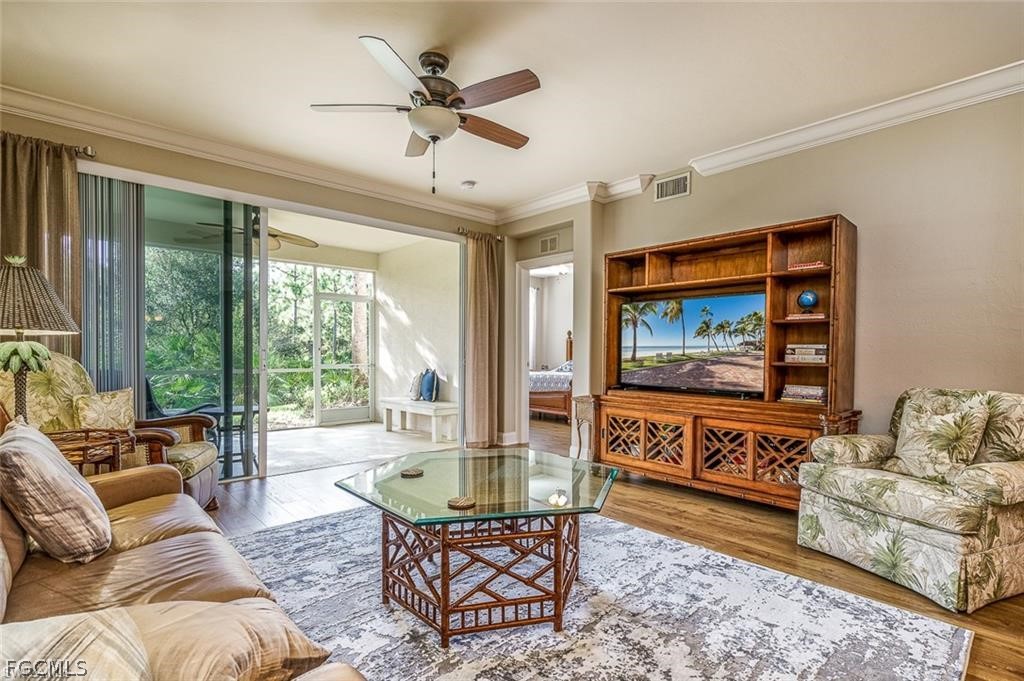 9667 Hemingway Lane, Unit 3107 Fort Myers, FL 33913 - Photo 4 of 23 a living room with furniture and a large window