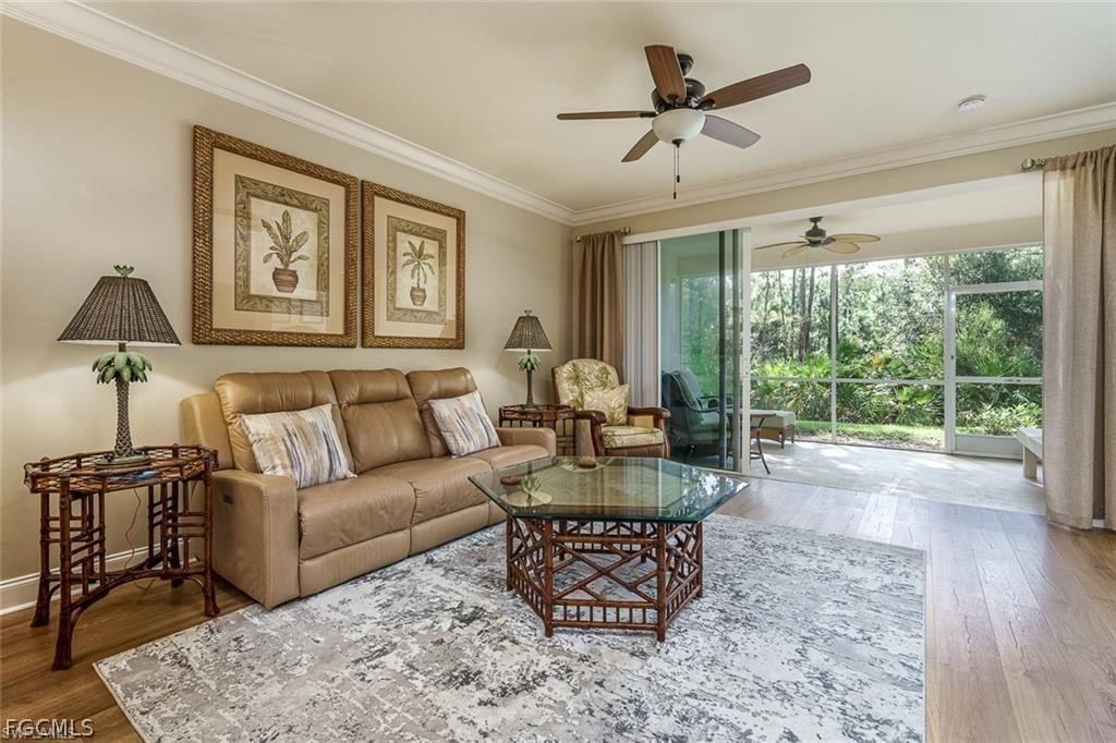 9667 Hemingway Lane, Unit 3107 Fort Myers, FL 33913 - Photo 5 of 23 a living room with furniture and a large window
