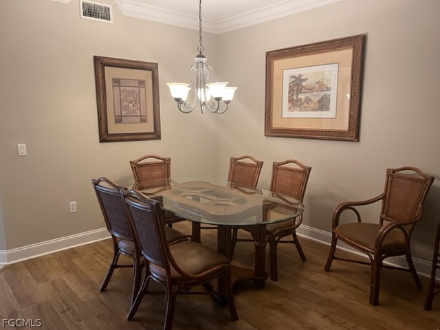 9667 Hemingway Lane, Unit 3107 Fort Myers, FL 33913 - Photo 6 of 23 a view of a dining room with furniture and wooden floor