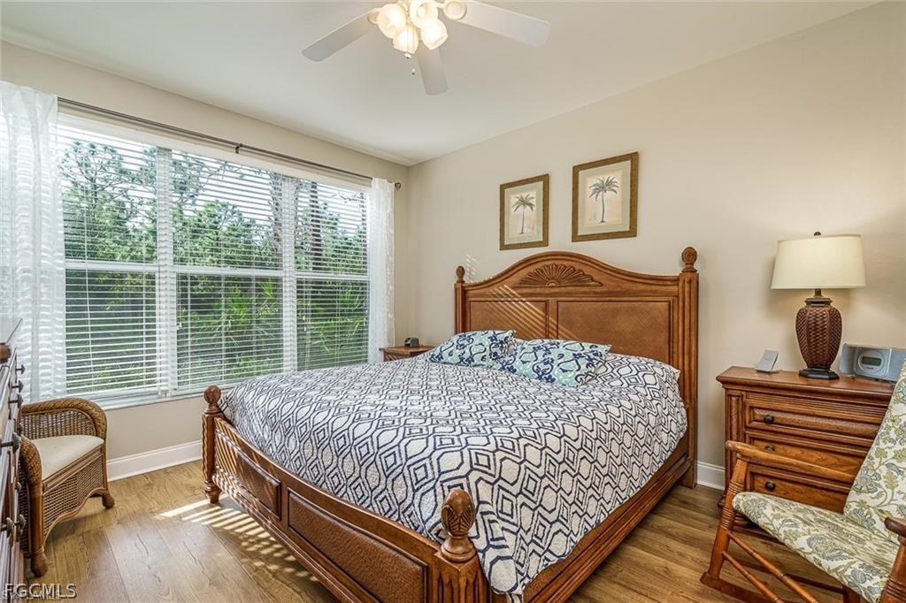 9667 Hemingway Lane, Unit 3107 Fort Myers, FL 33913 - Photo 9 of 23 a bedroom with a bed and a window