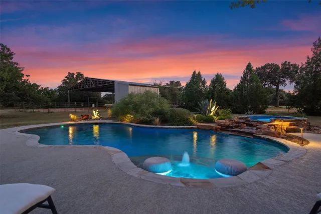 a view of a swimming pool with lounge chair