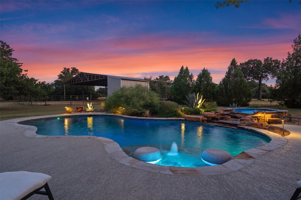 a view of a swimming pool with lounge chair