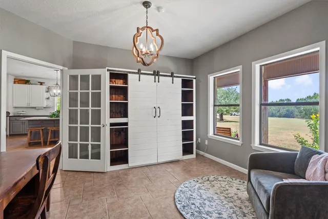 a bathroom with a double vanity sink mirror and toilet