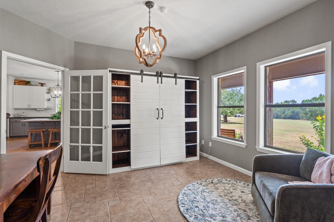 323 Patricia Road Georgetown, TX 78628 - Photo 11 of 40 a living room with furniture windows and a flat screen tv