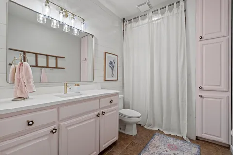 a kitchen with stainless steel appliances a sink a stove and a window