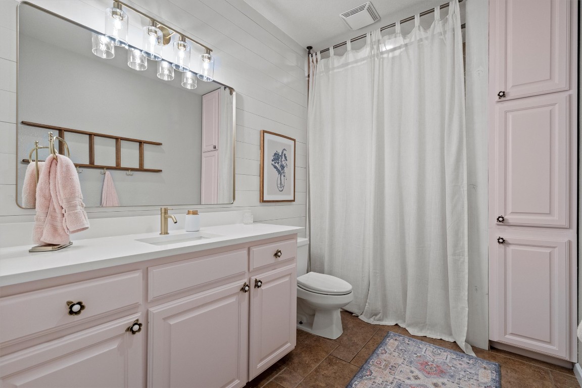 323 Patricia Road Georgetown, TX 78628 - Photo 15 of 40 a spacious bathroom with a double vanity sink a mirror and a shower