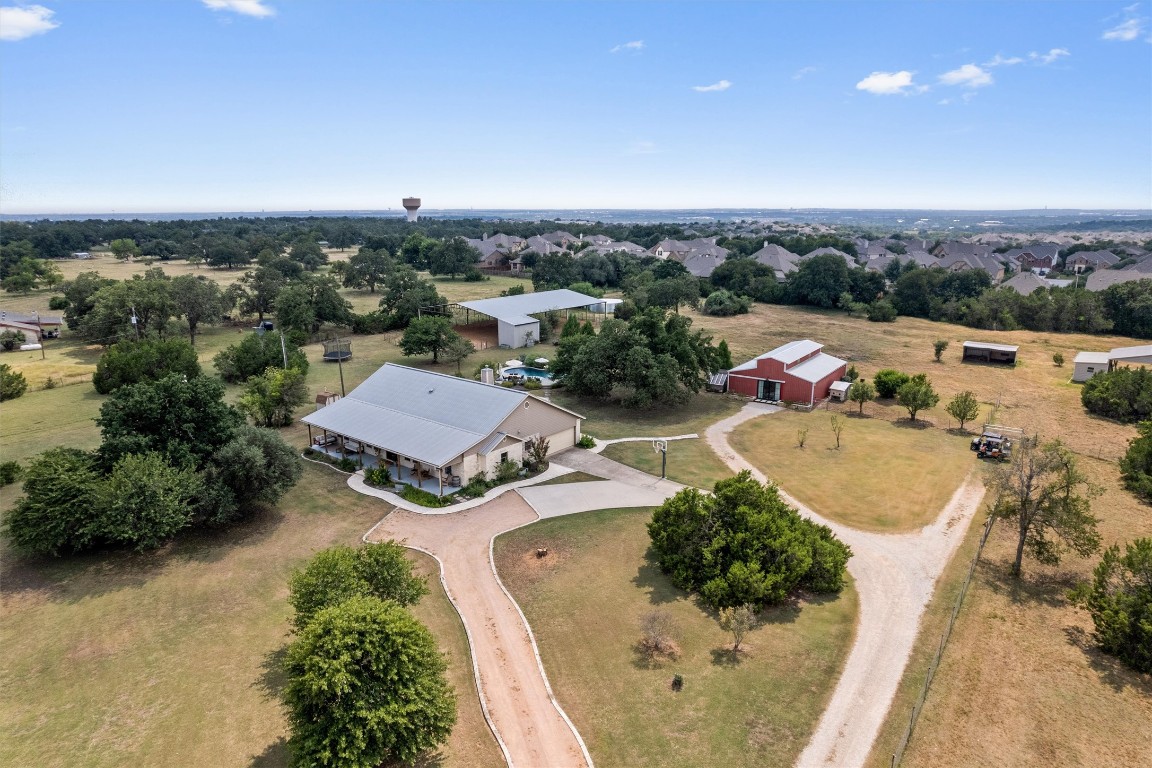 323 Patricia Road Georgetown, TX 78628 - Photo 2 of 40 an aerial view of a house with a swimming pool yard and outdoor seating