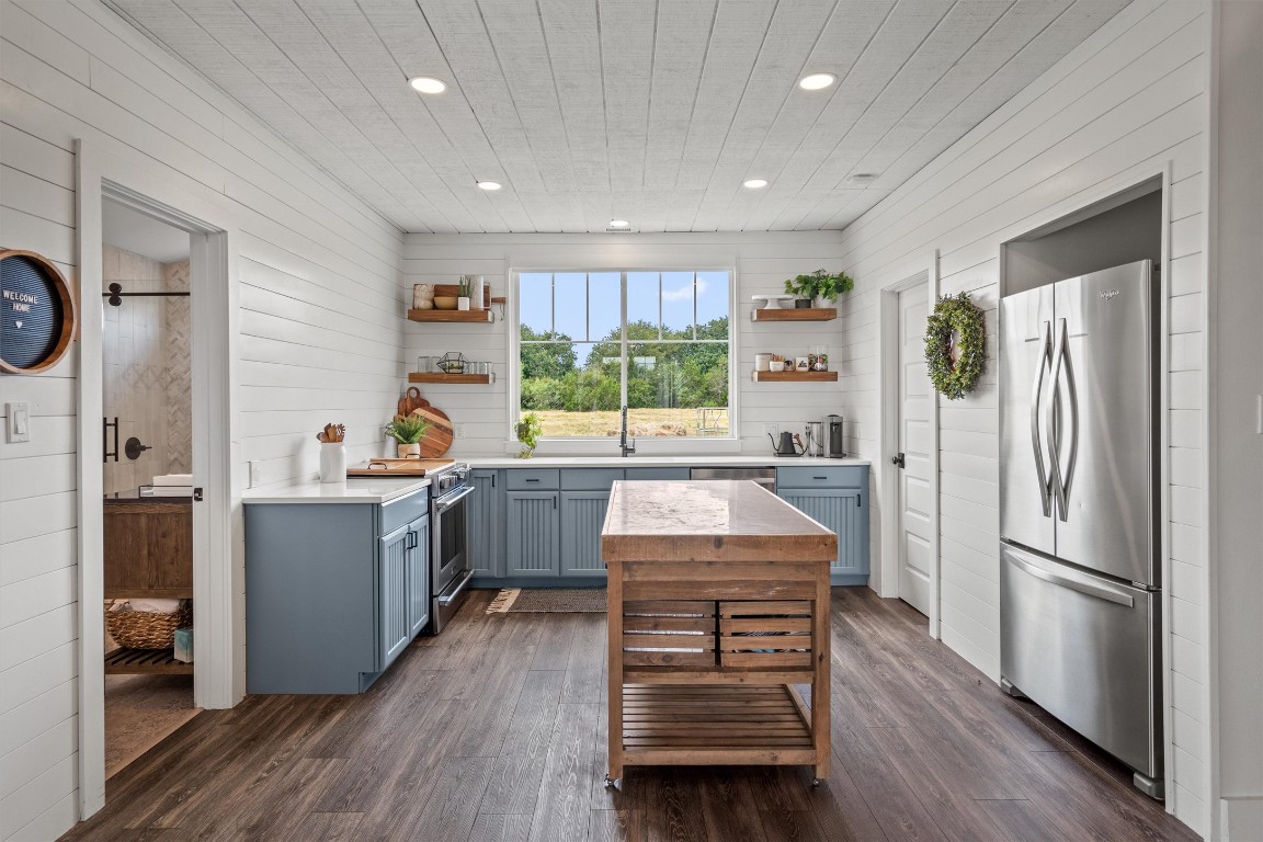 323 Patricia Road Georgetown, TX 78628 - Photo 26 of 40 a kitchen with a refrigerator a sink and cabinets