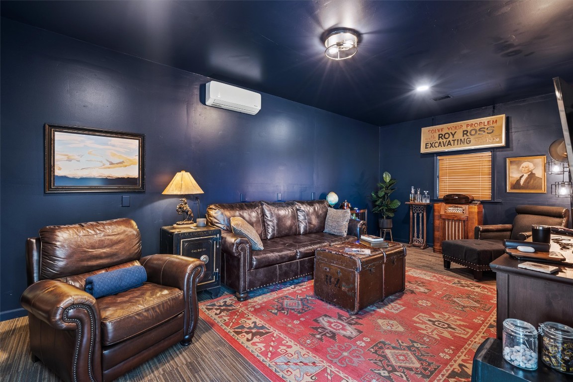 323 Patricia Road Georgetown, TX 78628 - Photo 29 of 40 a living room with furniture a rug and a flat screen tv