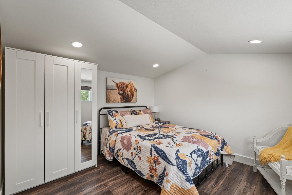 323 Patricia Road Georgetown, TX 78628 - Photo 30 of 40 a bedroom with a bed and wooden floor