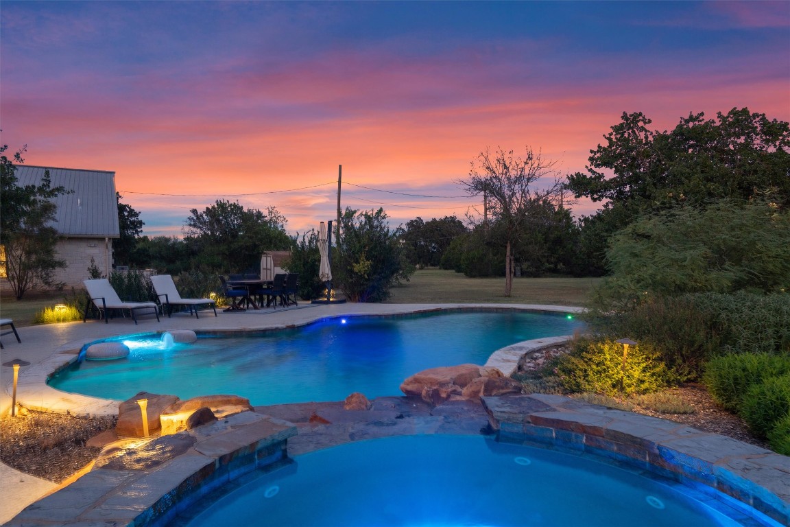 323 Patricia Road Georgetown, TX 78628 - Photo 4 of 40 a view of a swimming pool with a yard