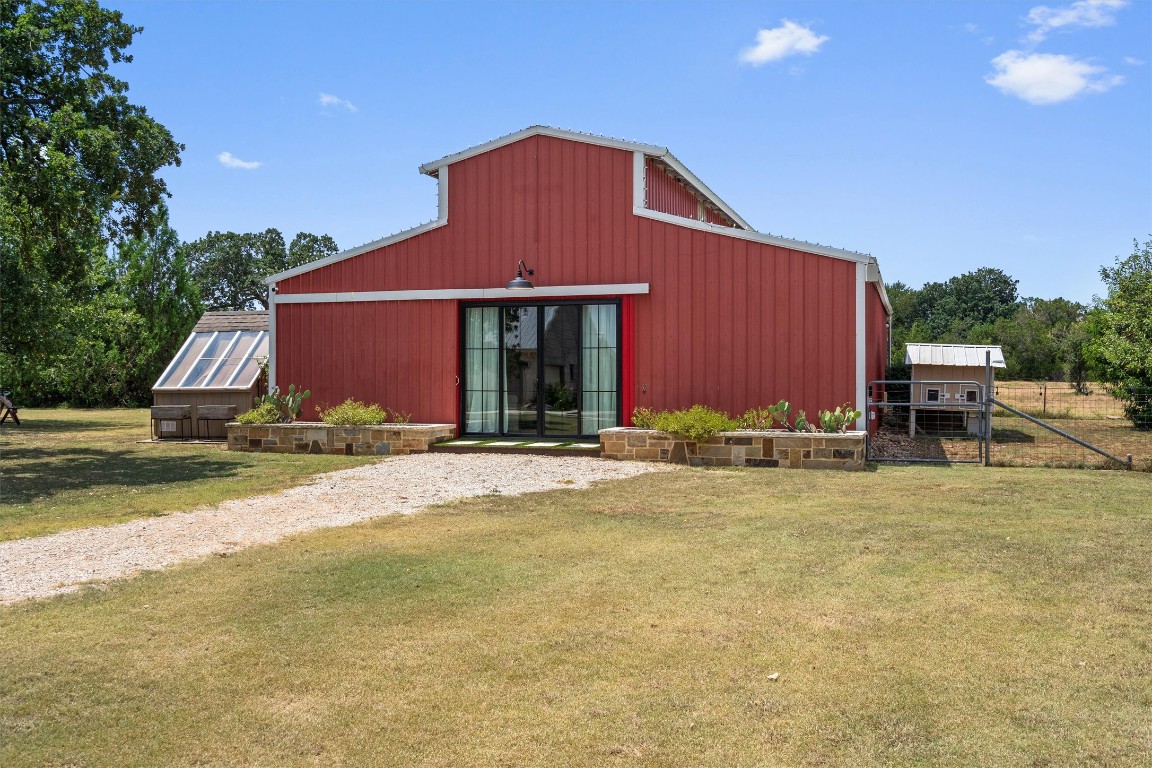 323 Patricia Road Georgetown, TX 78628 - Photo 6 of 40 a front view of house with yard and trees in the background