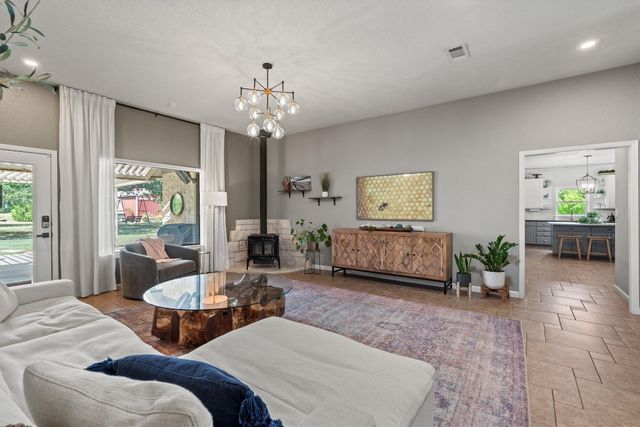 a living room with furniture or couch and a flat screen tv