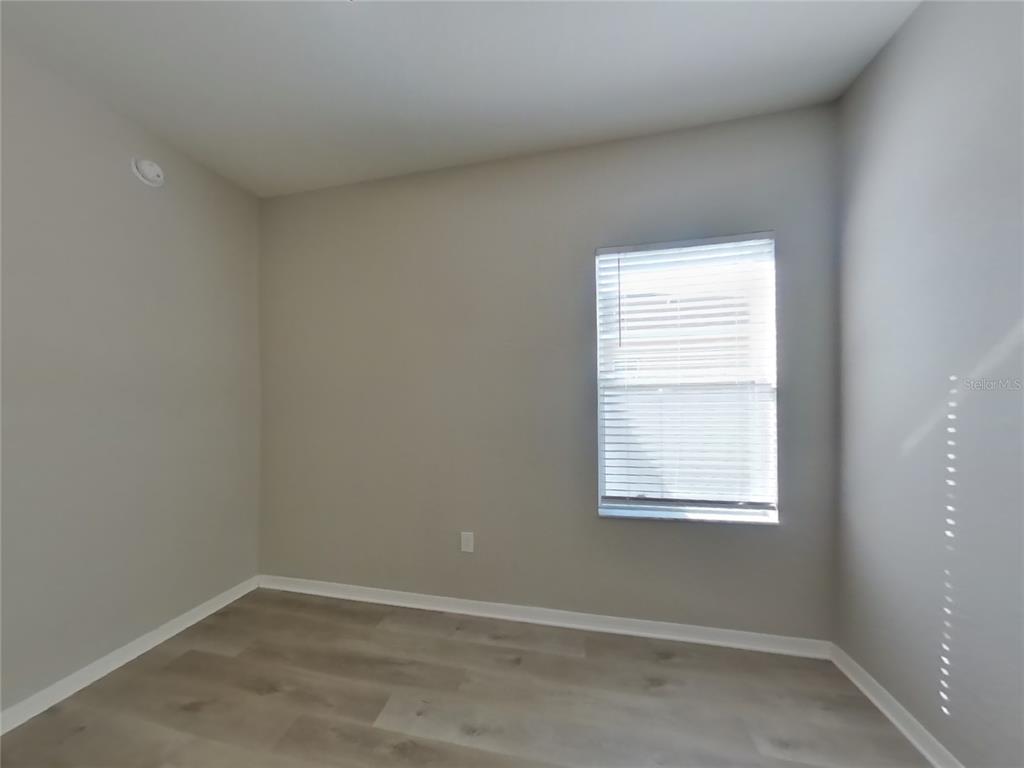 Undisclosed Address Zephyrhills, FL 33541 - Photo 11 of 21 an empty room with a window