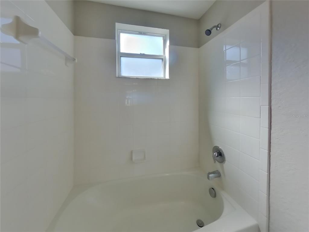 Undisclosed Address Zephyrhills, FL 33541 - Photo 15 of 21 a bathroom with a bathtub