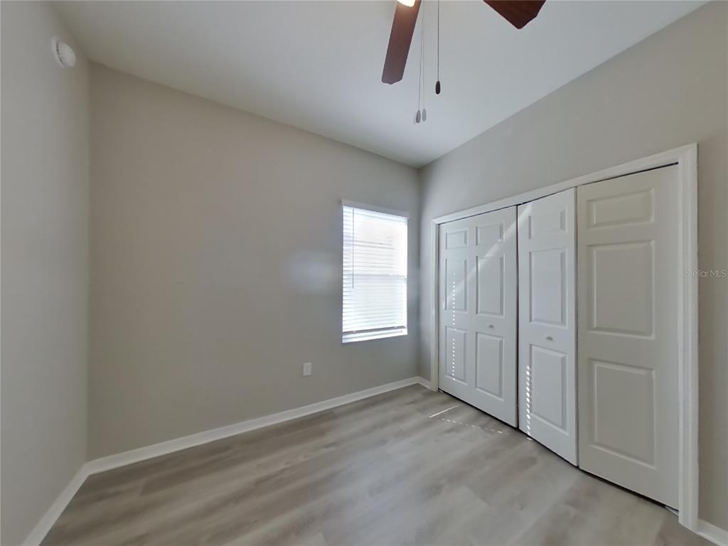 Undisclosed Address Zephyrhills, FL 33541 - Photo 10 of 21 a view of an empty room with a window