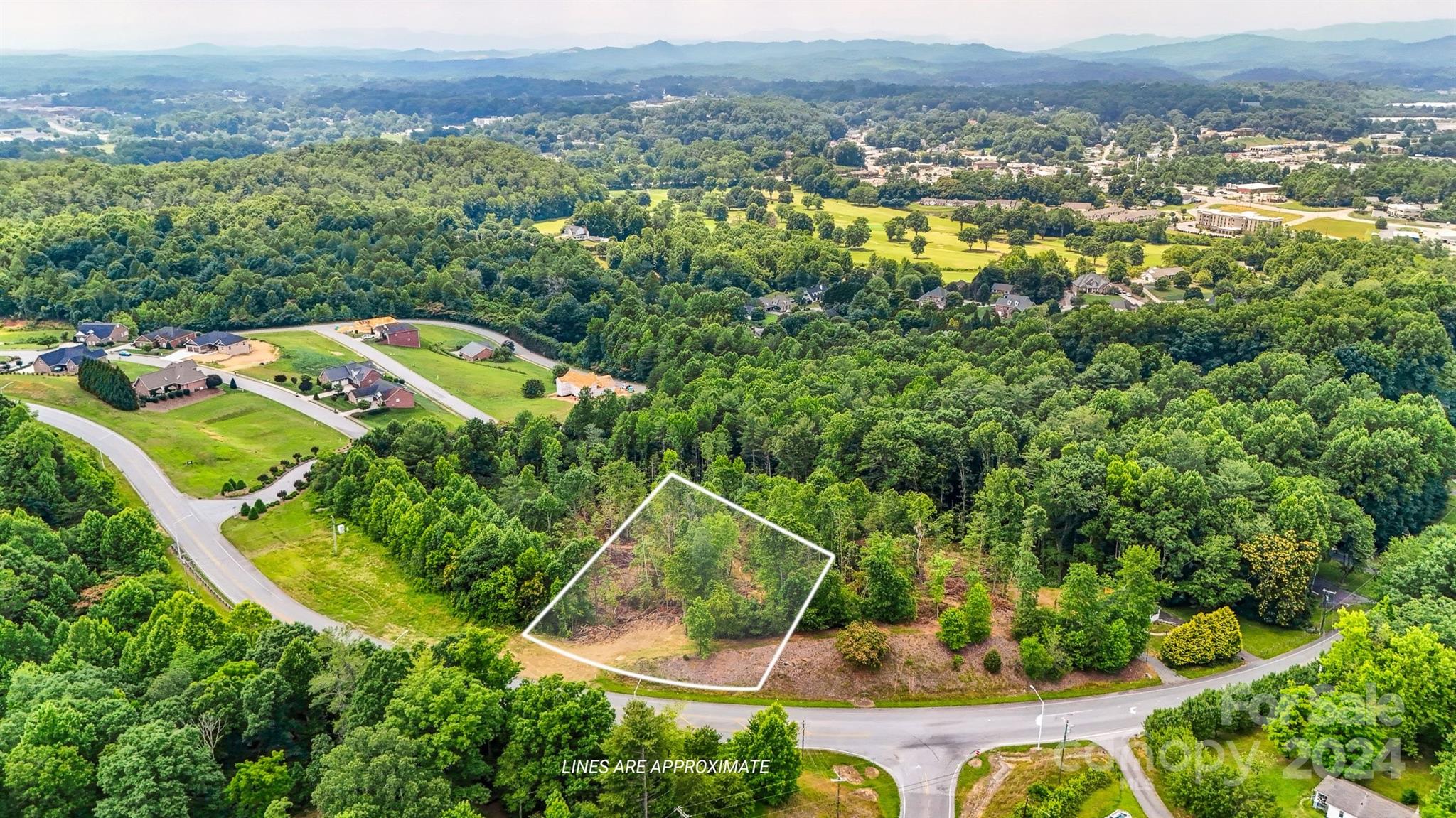 Tbd Tbd Mcclean Drive Extension, Unit 2 Lenoir, NC 28645 - Photo 1 of 3 an aerial view of a house with a yard and lake view
