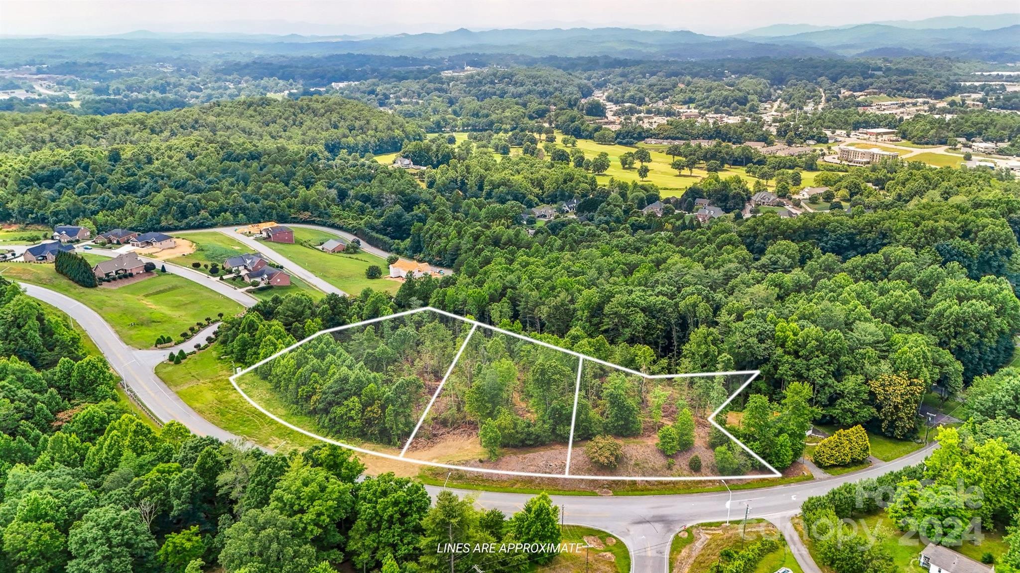 Tbd Tbd Mcclean Drive Extension, Unit 2 Lenoir, NC 28645 - Photo 3 of 3 an aerial view of a residential houses with outdoor space and swimming pool