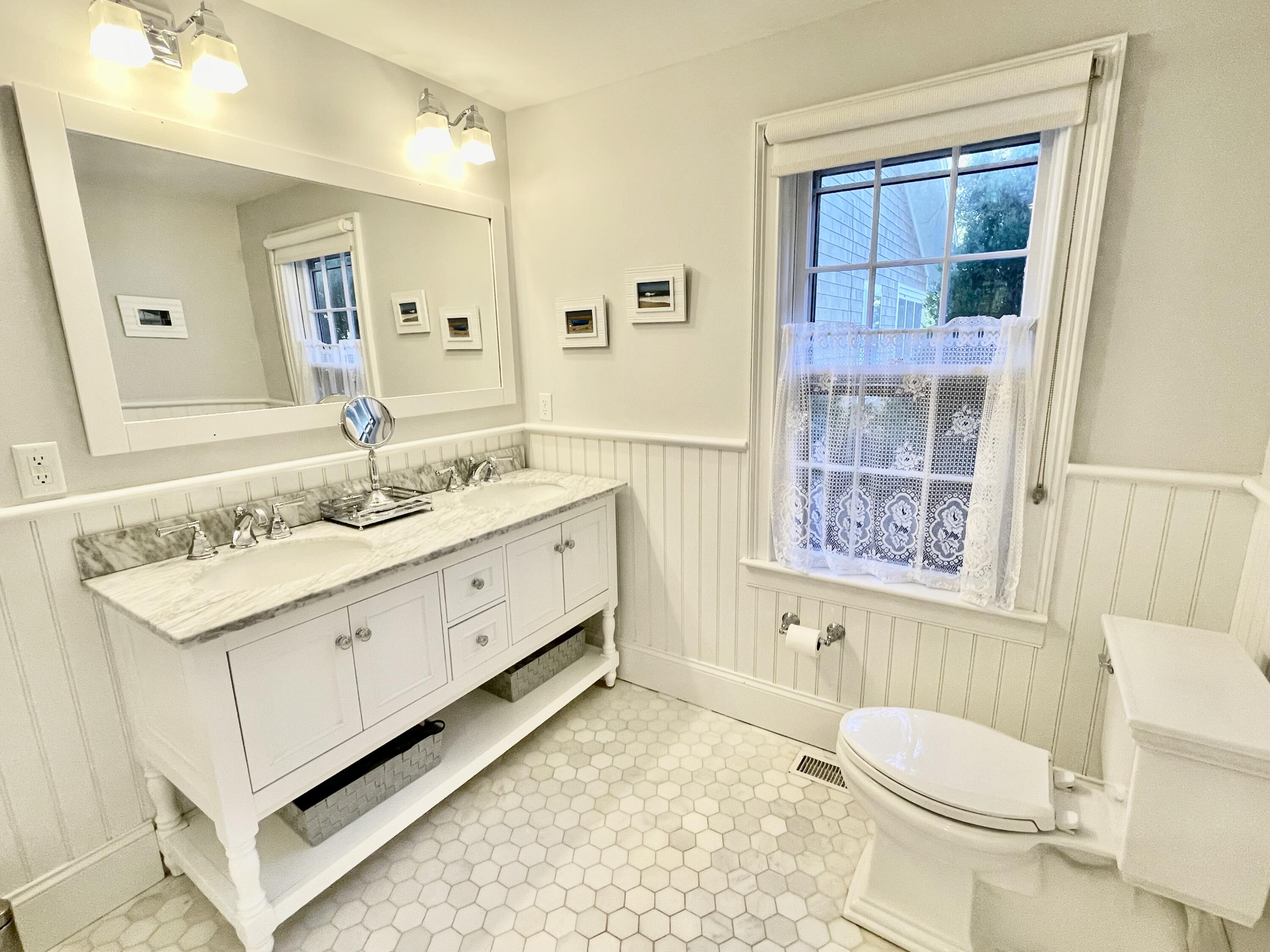 51 Beach Road Orleans, MA 02653 - Photo 30 of 46 a spacious bathroom with a granite countertop sink toilet and shower