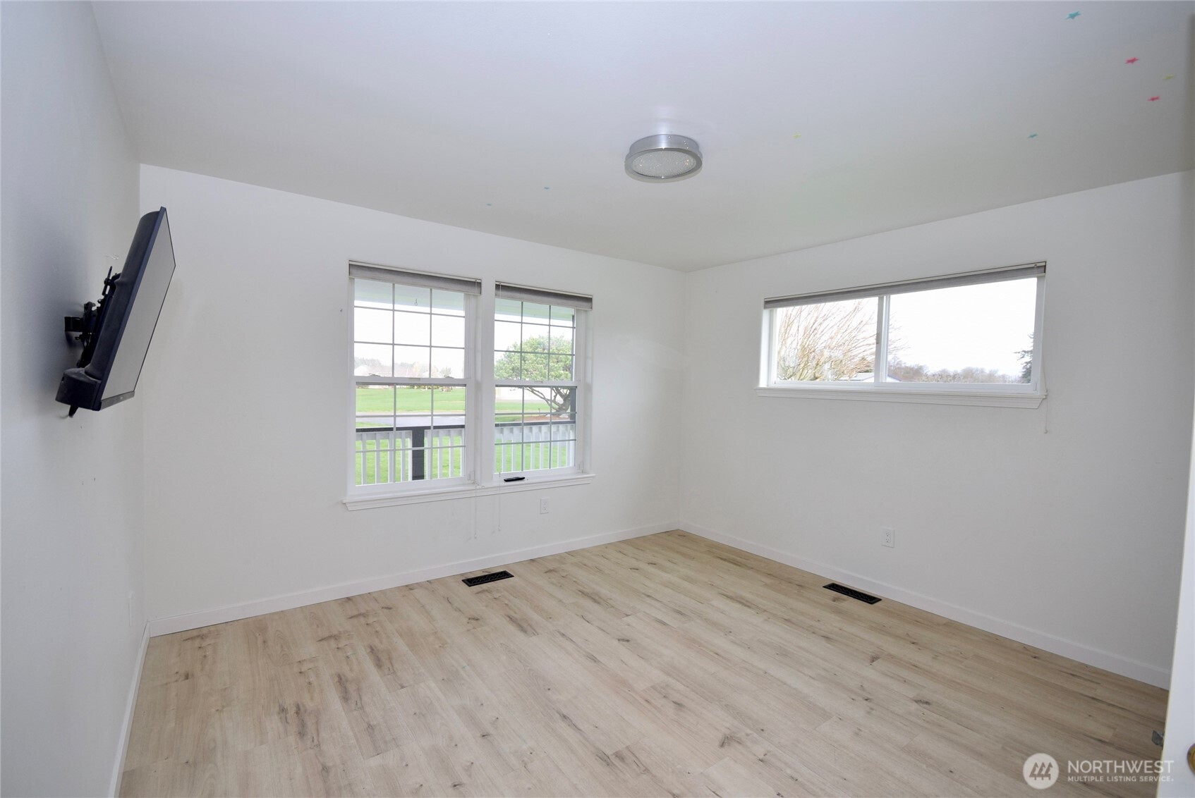 71 John Carl Road Sequim, WA 98382 - Photo 21 of 37 a view of empty room with windows