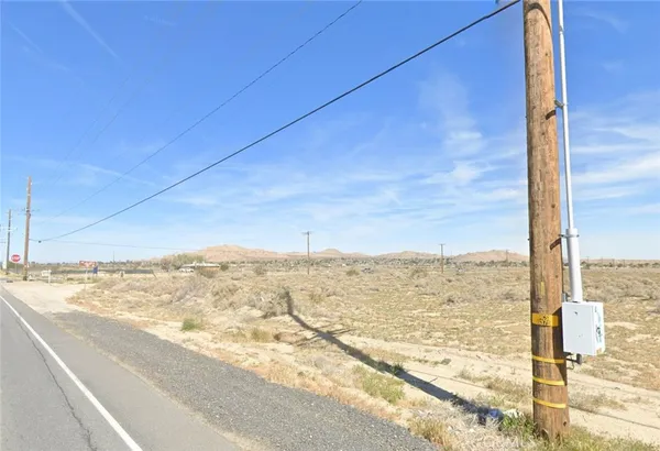 a view of a road from a big yard